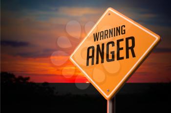 Anger on Warning Road Sign on Sunset Sky Background.