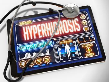 Hyperhidrosis - Diagnosis on the Display of Medical Tablet and a Black Stethoscope on White Background.