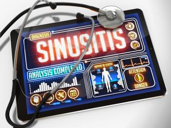 Sinusitis - Diagnosis on the Display of Medical Tablet and a Black Stethoscope on White Background.