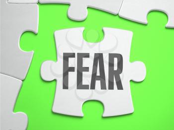 Fear - Jigsaw Puzzle with Missing Pieces. Bright Green Background. Close-up. 3d Illustration.