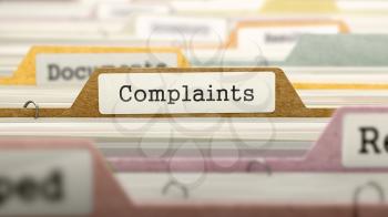 Complaints - Folder Register Name in Directory. Colored, Blurred Image. Closeup View.