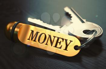 Money - Bunch of Keys with Text on Golden Keychain. Black Wooden Background. Closeup View with Selective Focus. 3D Illustration. Toned Image.