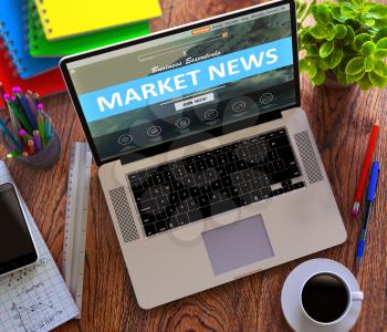 Market News Concept. Modern Laptop and Different Office Supply on Wooden Desktop background.