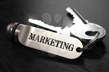 Marketing Concept. Keys with Keyring on Black Wooden Table. Closeup View, Selective Focus, 3D Render. Black and White Image.