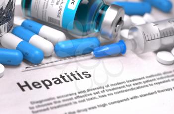 Diagnosis - Hepatitis. Medical Concept with Blue Pills, Injections and Syringe. Selective Focus. Blurred Background.