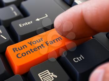 Run Your Content Farm Button. Male Finger Clicks on Orange Button on Black Keyboard. Closeup View. Blurred Background.