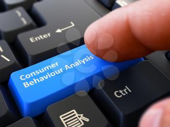 Consumer Behaviour Analysis - Written on Blue Keyboard Key. Male Hand Presses Button on Black PC Keyboard. Closeup View. Blurred Background.