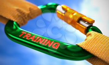 Green Carabiner between Orange Ropes on Sky Background, Symbolizing the Training. Selective Focus.