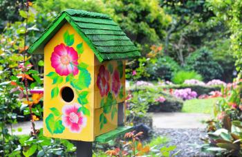 Royalty Free Photo of a Birdhouse in a Garden