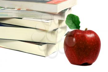 Royalty Free Photo of a Pile of Books and an Apple