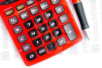 Royalty Free Photo of a Red Calculator and Pen