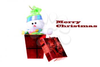 Small red christmas gift box with a snowman inside