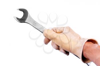 Hand  with a glove holding a combination wrench isolated on white