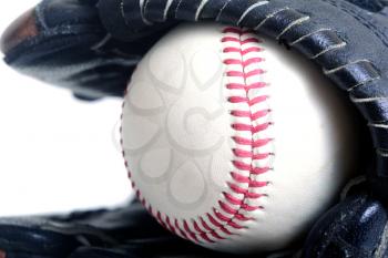 Macro shot of a baseball and a glove