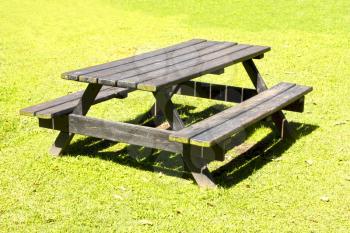 Picnic table outside on a grass field