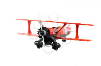 Toy red bi-plane  isolated on a white background
