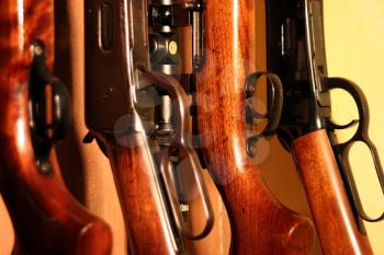 Macro shot of rifles in a gun cabinet