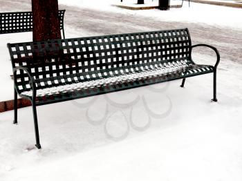 Benches at a city park on a snowy afternoon in Atlanta 