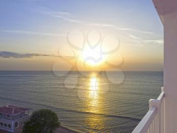 Beautiful sunrise seen from a hotel balcony looking into the ocean
