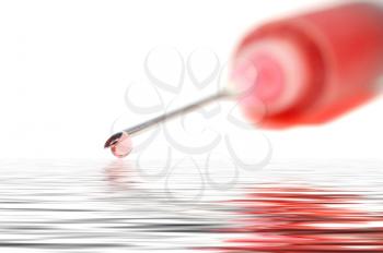 Syringe with red liquid isolated and in a flood