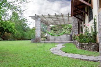 Wide angle shot of a Pergola in the backyard of a home