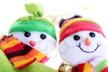 Macro shot of two snowmen isolated on a white background