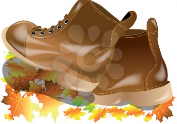 walking boots with autumn leaves isolated on white