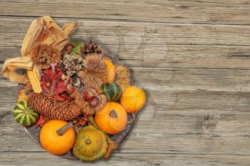 autumn bouquet with vegetables on a wooden surface