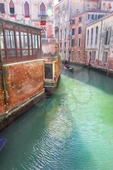 Gondola on lateral narrow Canal, Venice, Italy.