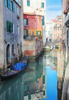 Gondolas In Canal with bridge Venice Italy