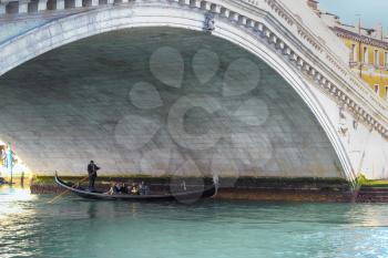 Rialto Bridge and Grand Canal with gondolier