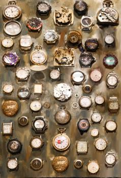 collection of old watches on grunge background