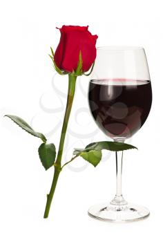 Romantic glass of red wine with long stemmed rose