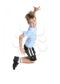 Active, energetic and happy go lucky boy leaping and smiling.  fitness or concept