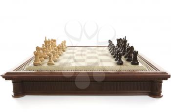 Chess board and wooden playing pieces