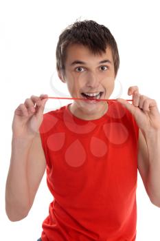 A smiling boy eating jelly candy. White background.