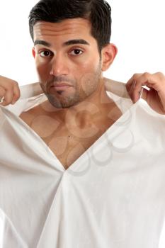 Handsome masculine man removing or putting on a shirt.  White background.