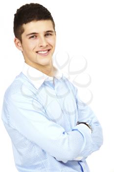 Portrait of young handsome businessman with crossed arms looking at camera
