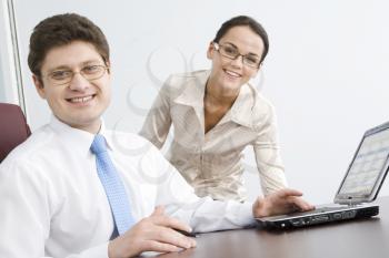 Photo of smiling boss looking at camera with woman on background