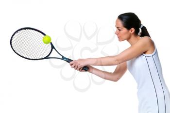 Photo of a woman playing a tennis forehand shot, isolated on white.