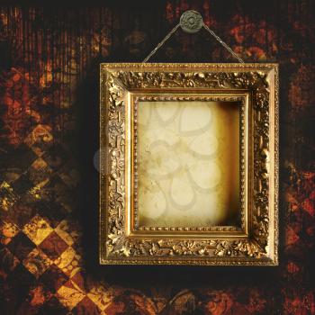 Royalty Free Photo of an Antique Frame on Grungy Wallpaper