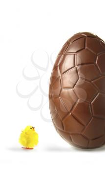 Royalty Free Photo of a Chocolate Egg and Baby Chick
