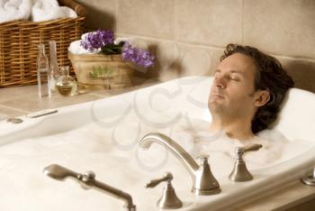 male client in an aroma bath at a spa