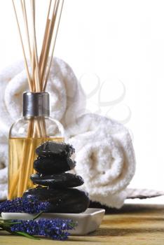massage stones and towels spa tools and oil