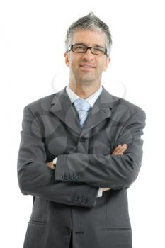 Portrait of businessman wearing gray suit and glasses, standing with arms crossed, smiling.  Isolated on white background.