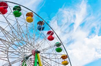 Colorful ferris wheel on blue sky background, Moscow, Russia, East Europe