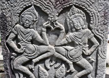 Apsara dancers carved on the wall of Bayon Temple, Angkor area, Cambodia, Southeast Asia