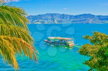 Royalty Free Photo of a Boat on Lake Toba in Sumatra, Indonesia