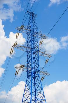 Power line tower on blue sky background