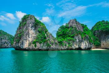 Mountain island and lonely beach in Halong Bay, Vietnam, Southeast Asia